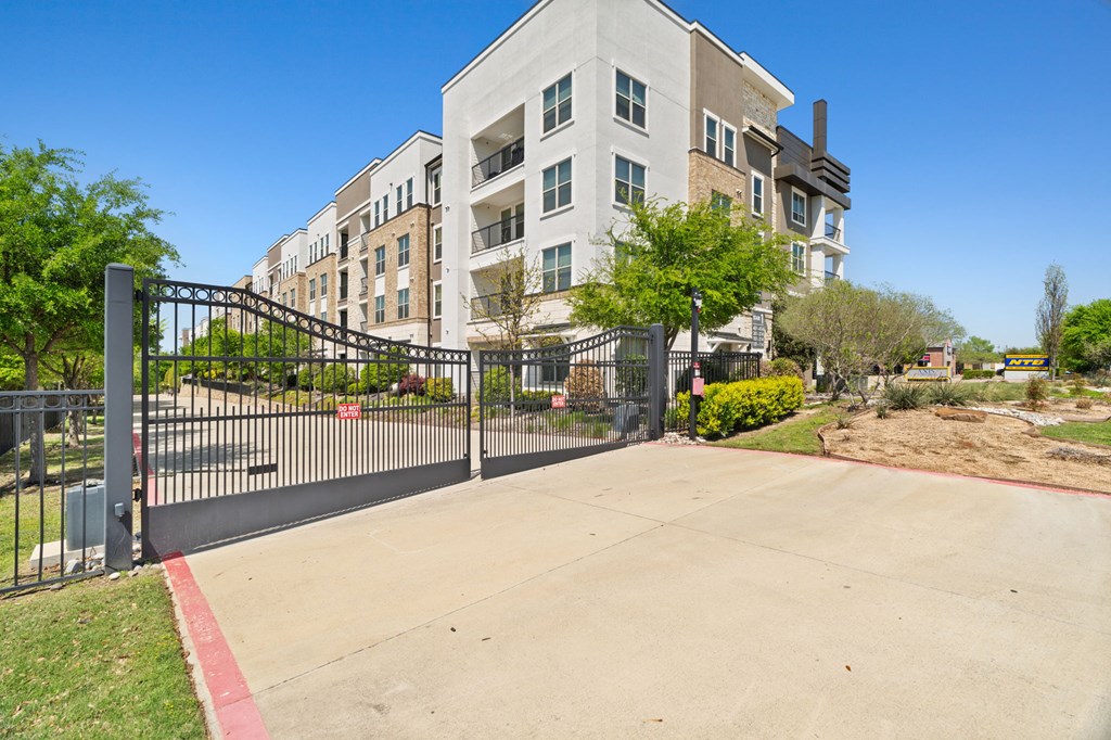 A large building with a gate in front of it.