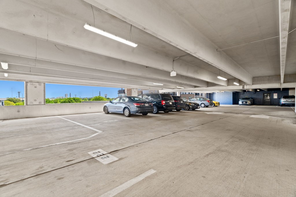 A parking garage with cars parked in it.