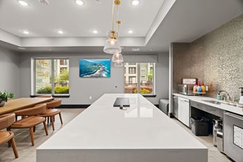 A modern kitchen with a large island in the center.