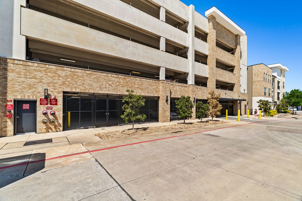 A parking garage with a clear blue sky in the background.