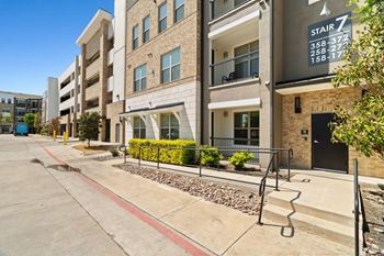 A multi-story building with a sign that says "STAIR 7" above the stairs.