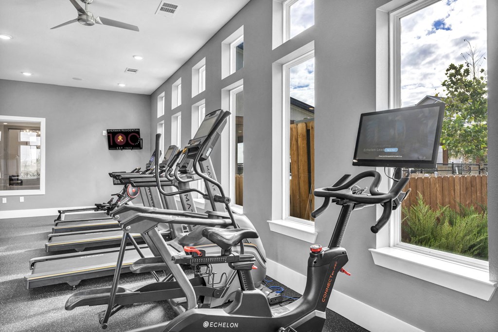 the gym is equipped with state of the art cardio equipment and windows