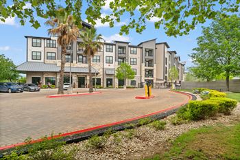 A large building with a red border around the courtyard.
