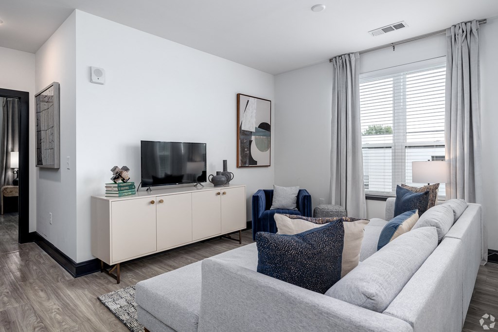 a living room with a couch and a tv