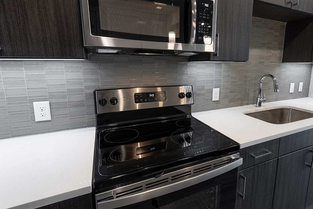 a kitchen with a stove and a sink