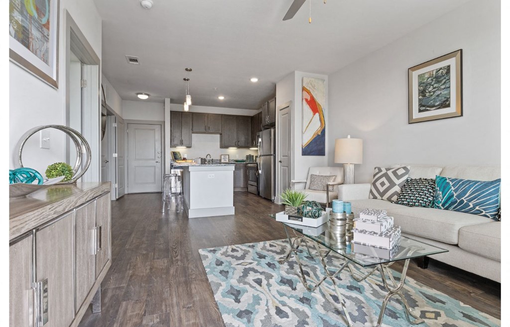 a living room with a couch and a glass table