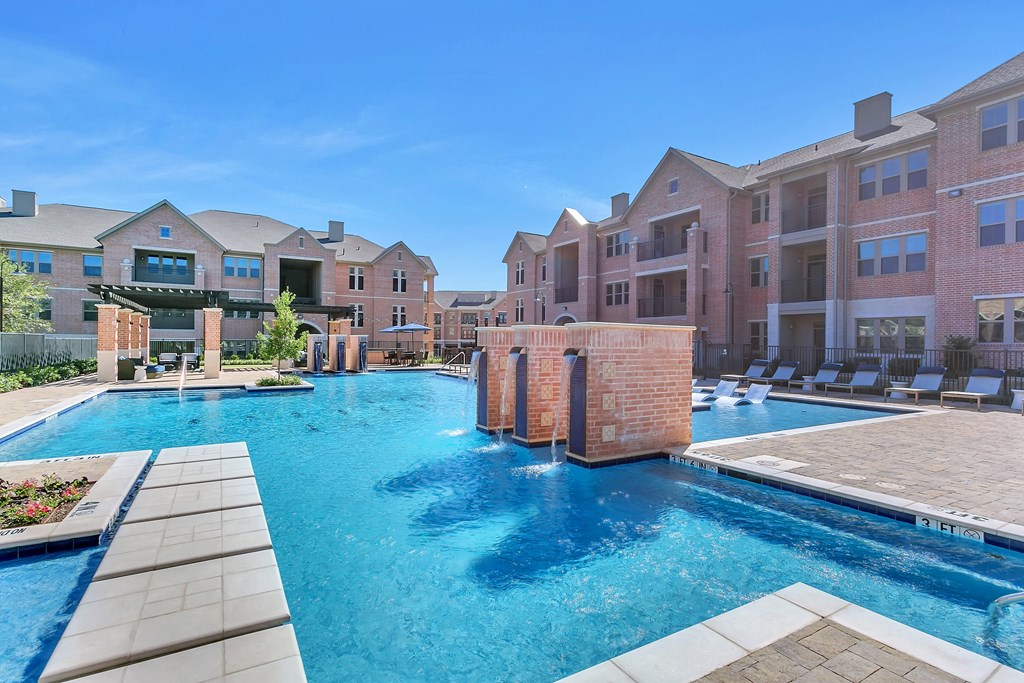 our apartments offer a large swimming pool with lounge chairs