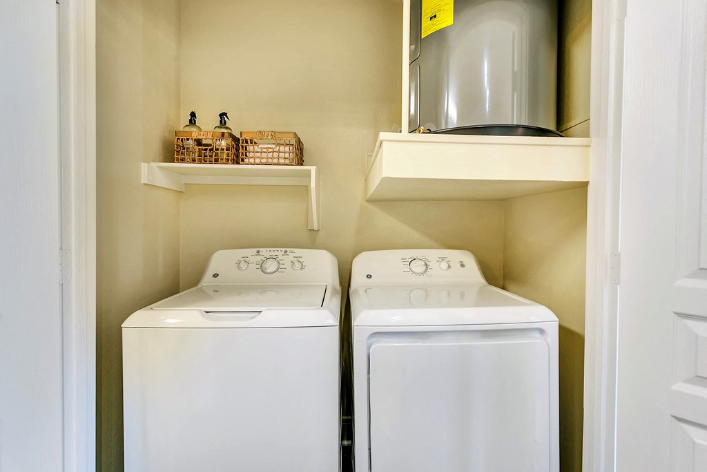 the washer and dryer in the laundry room of a home