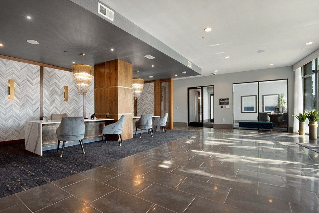 a large lobby with chairs and a table