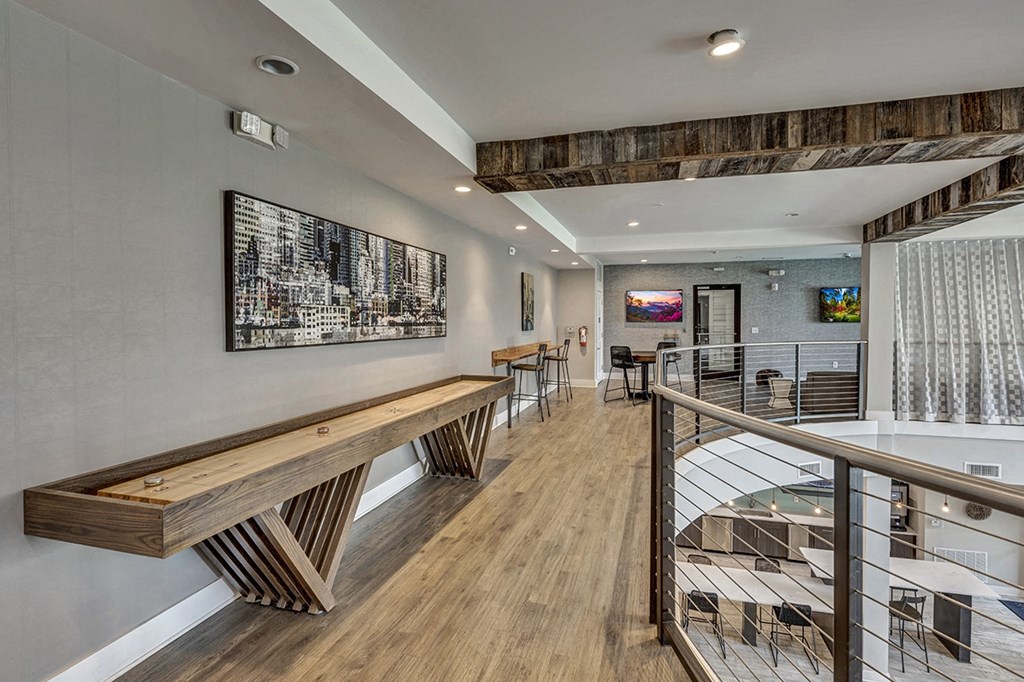 the residence apartment building lobby with staircase and wood bench