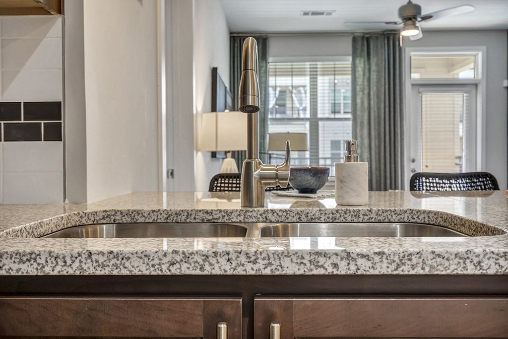 a kitchen with granite counter tops and a sink