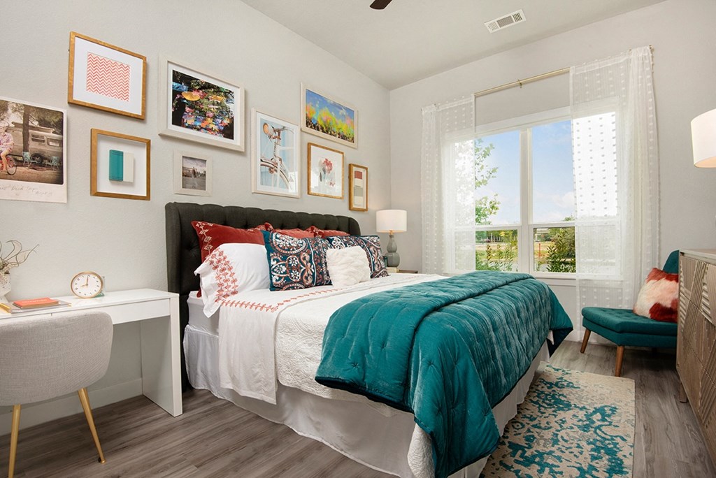 a bedroom with a bed and a window
