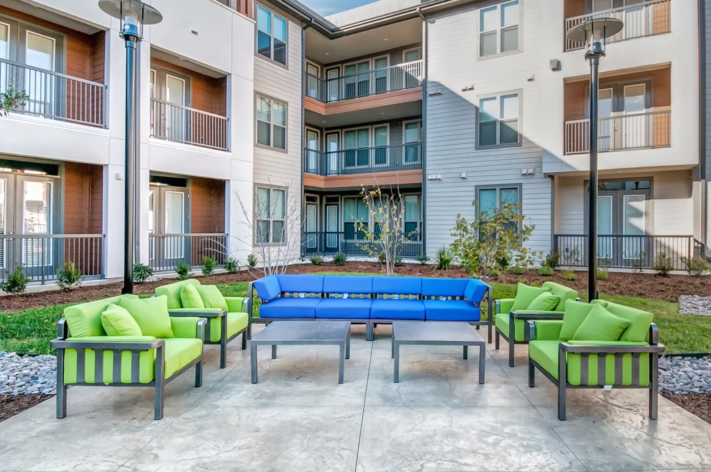 the preserve at ballantyne commons apartments clubhouse with couches and chairs