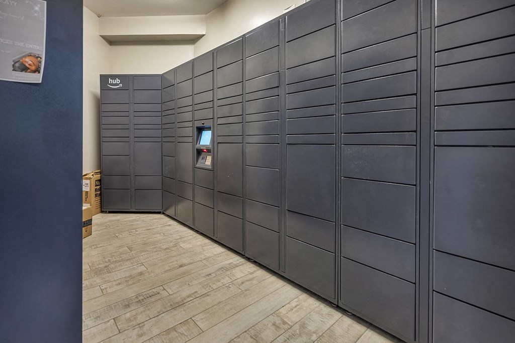 a row of lockers in a room with wood floors