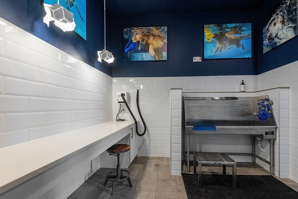 a spa room with a tub and a sink and a blue and white wall with