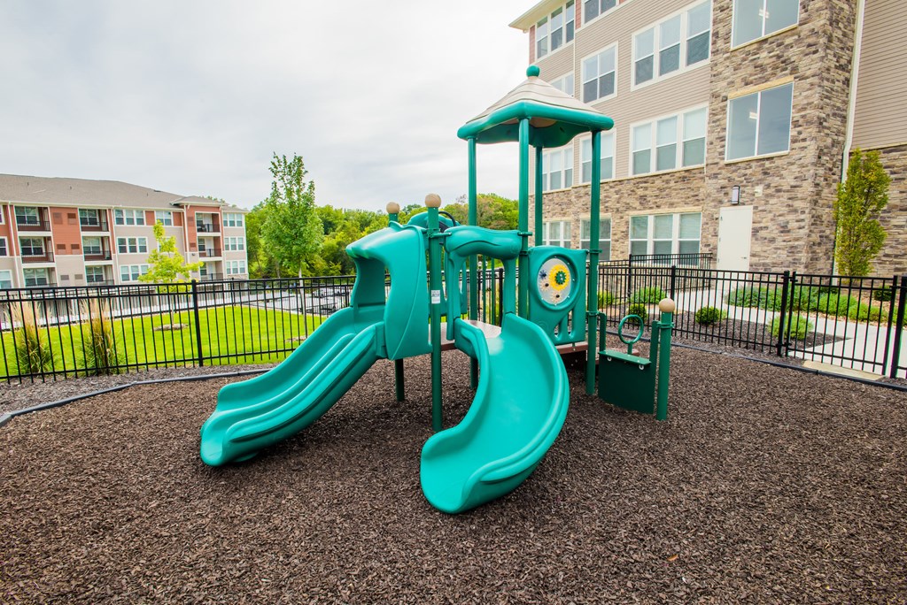 the playground at the flats at big tex apartments