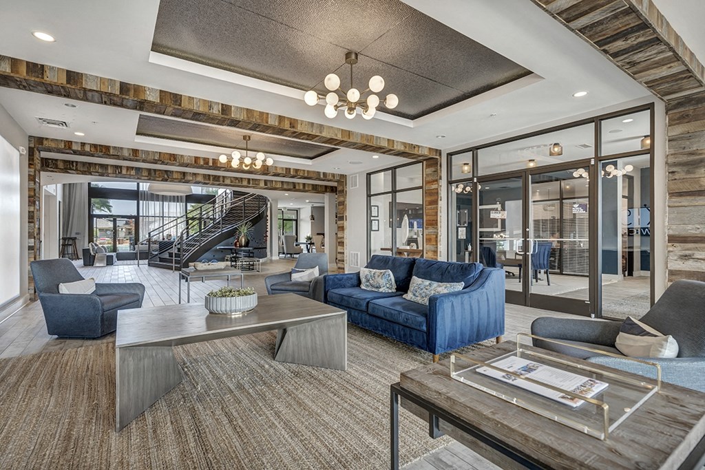 a living room with a blue couch and a table