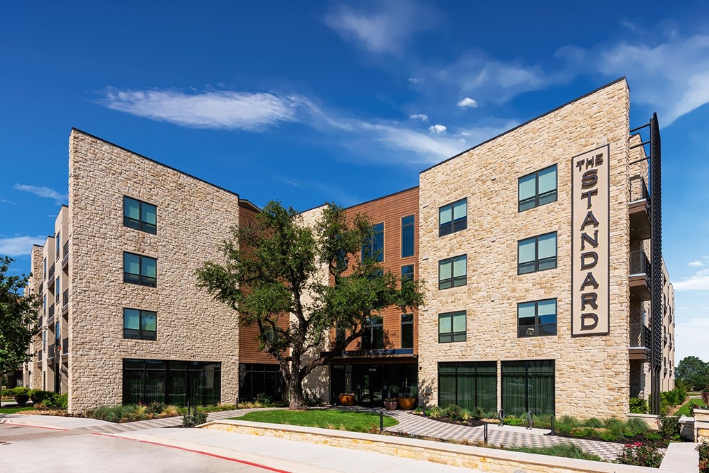 a large brick building with a sign on the side of it