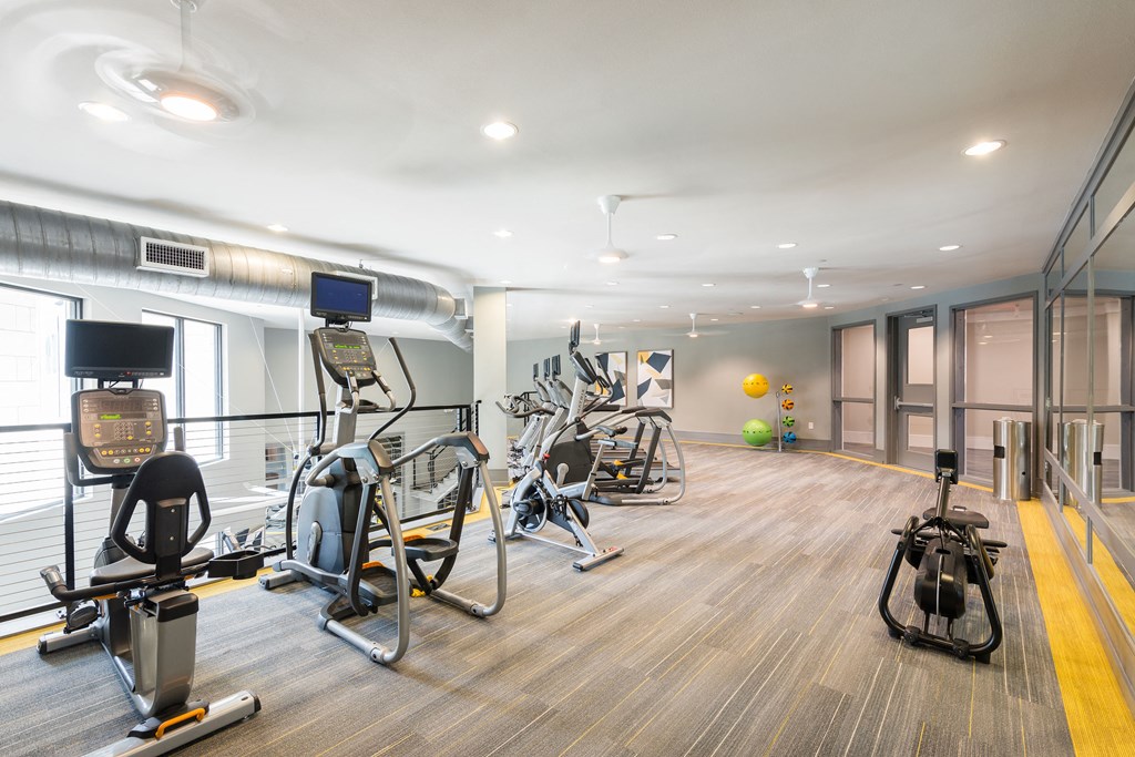 a gym with a lot of exercise equipment