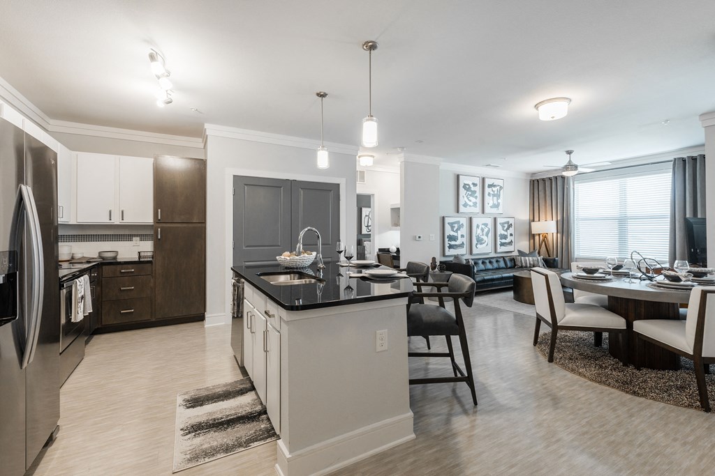 a kitchen and dining area in a 555 waverly unit