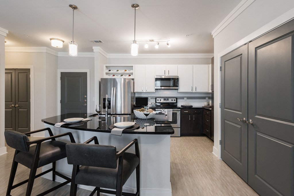 a kitchen and dining area in a 555 waverly unit