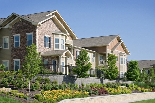 a large house with a garden in front of it