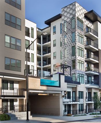 an apartment building with a geometric design on the side of it
