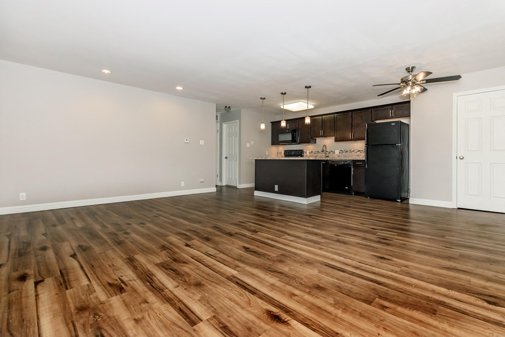 the living room and kitchen in a 555 waverly unit