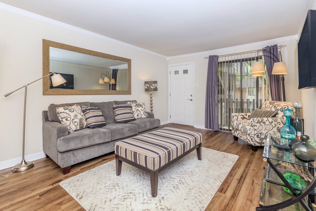 a living room with a couch and a chair