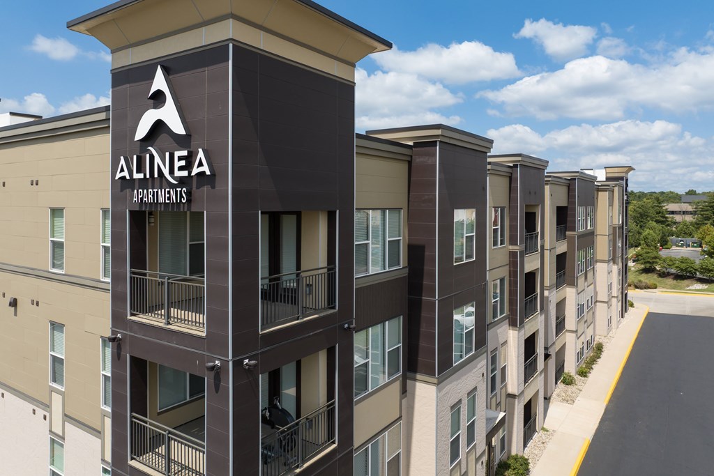 A view of Alinea Apartments with a clear blue sky in the background. at Alinea Town and Country Luxury Apartments in Des Peres MO 63131.