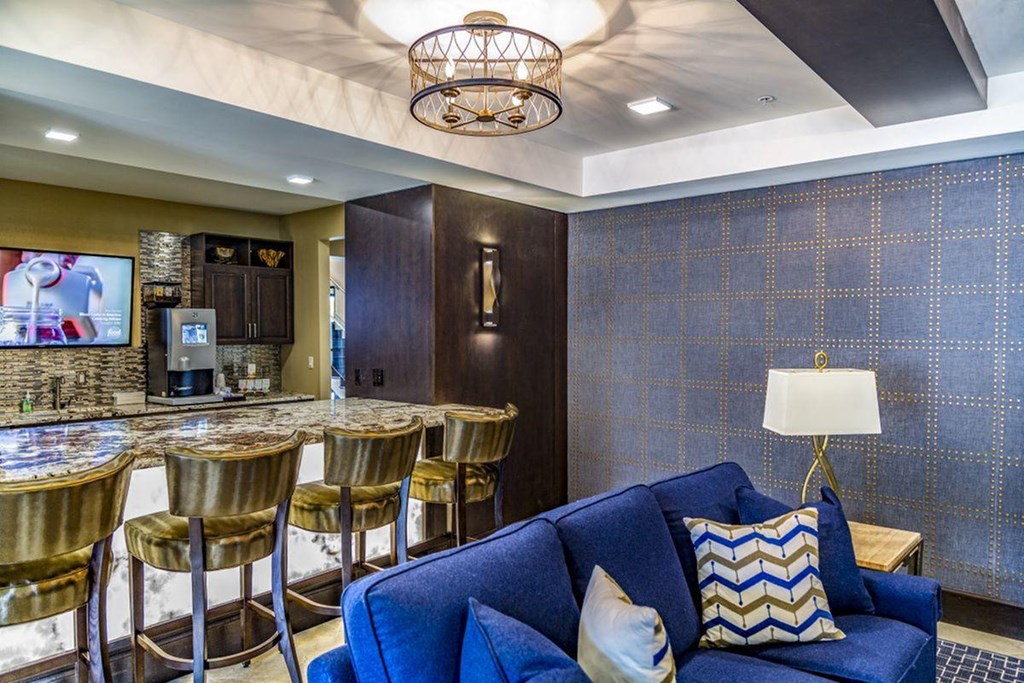 a living room with a bar and a couch