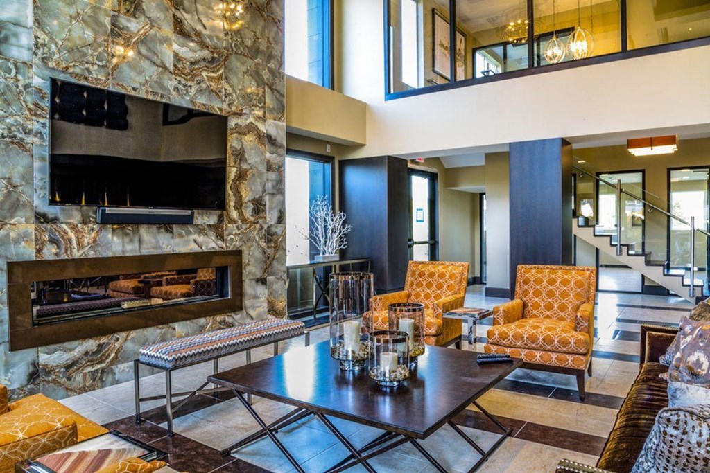 a living room with a fireplace and a table