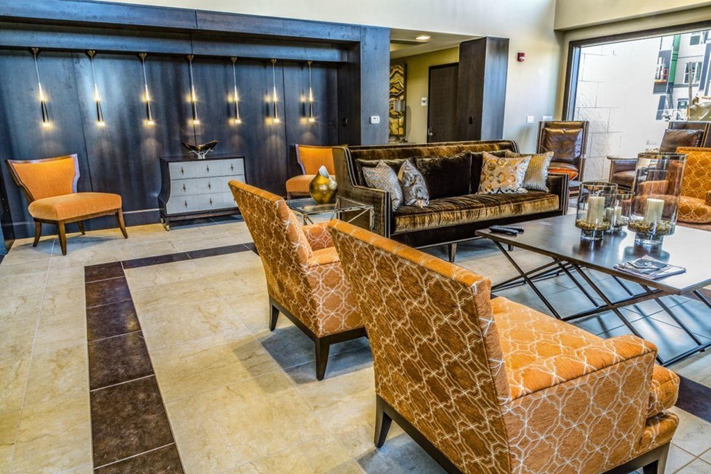 a lobby with couches and chairs and a table