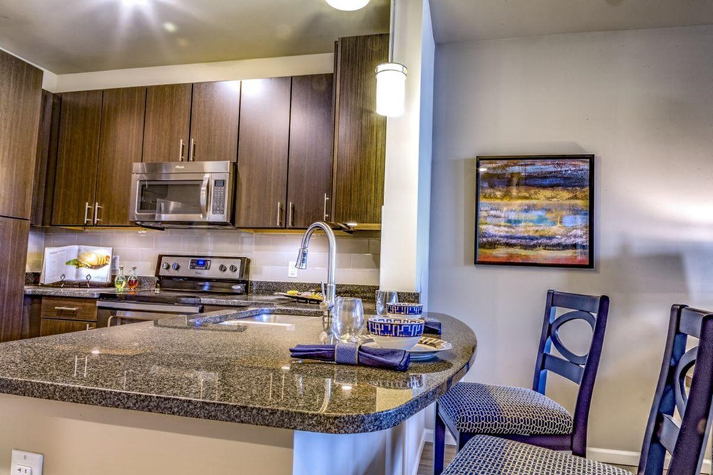 a kitchen with a granite counter top and a sink