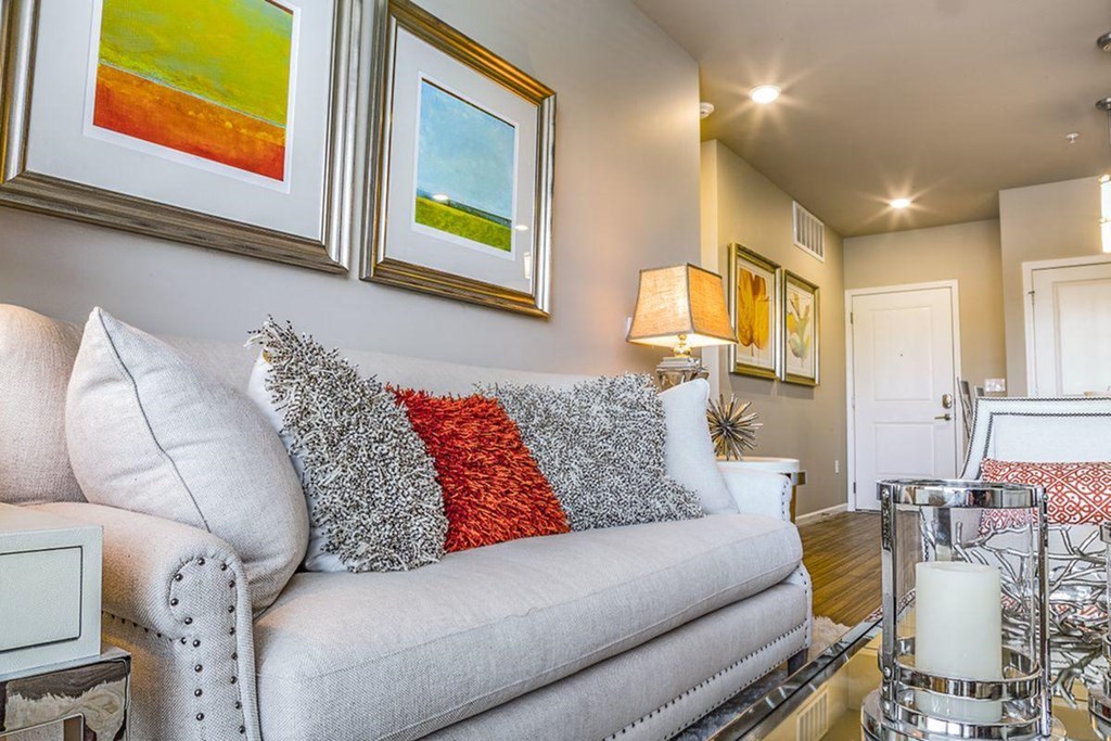a living room with a couch and pillows