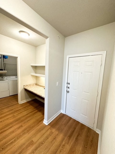 a room with a closet and a white door