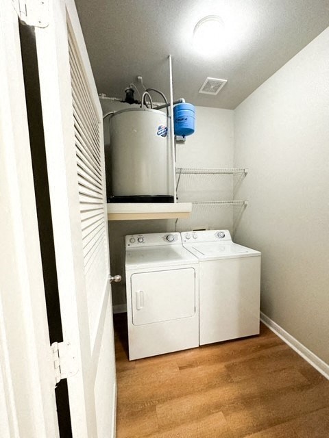 a laundry room with a washer and a dryer in it