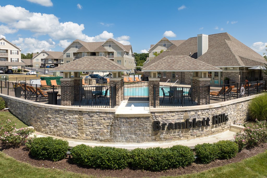 Gazebos with a pool in the apartment community at Bramblett Hills Luxury Apartments in O Fallon MO 63366