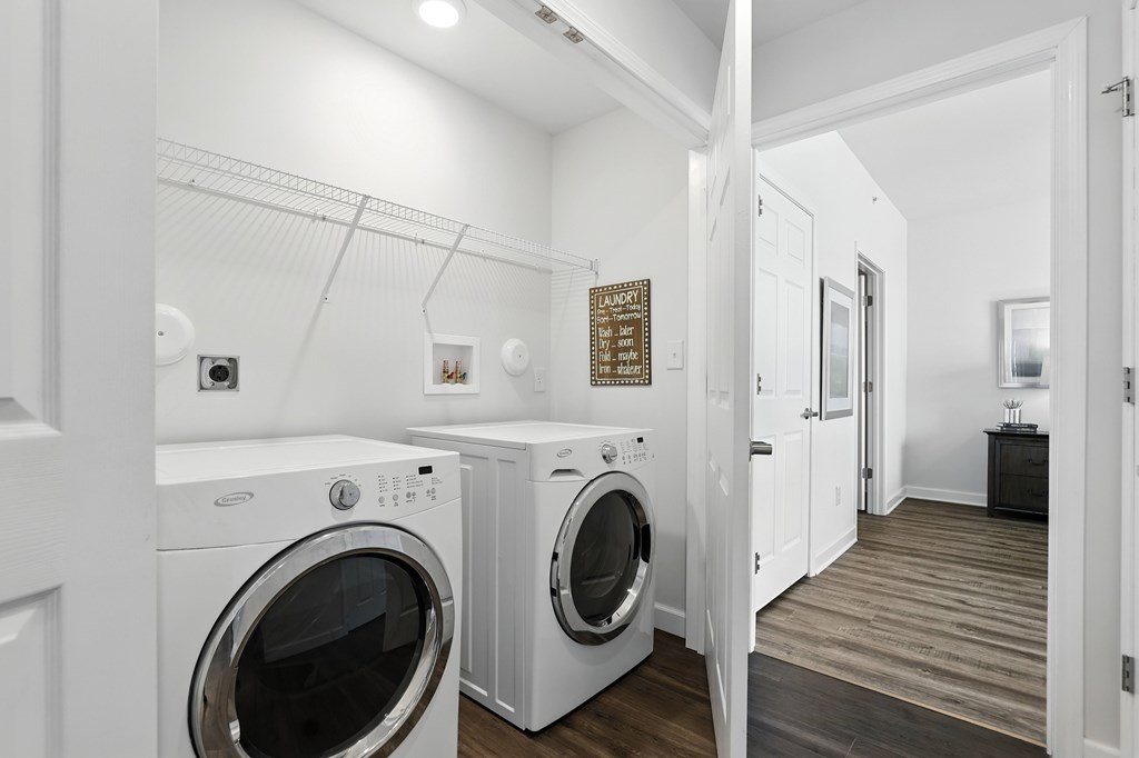 A laundry room with a washer and dryer at Bramblett Hills Luxury Apartments in O Fallon MO 63366
