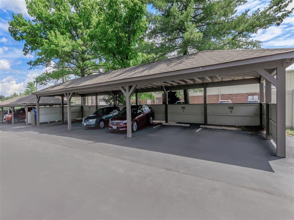 a parking garage with two cars parked in it
