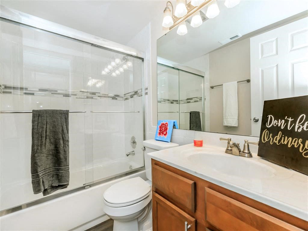 a bathroom with a sink toilet and a shower