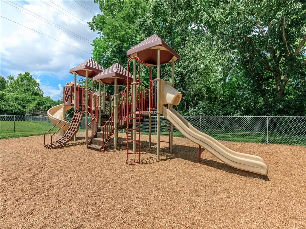 a playground with slides at a park