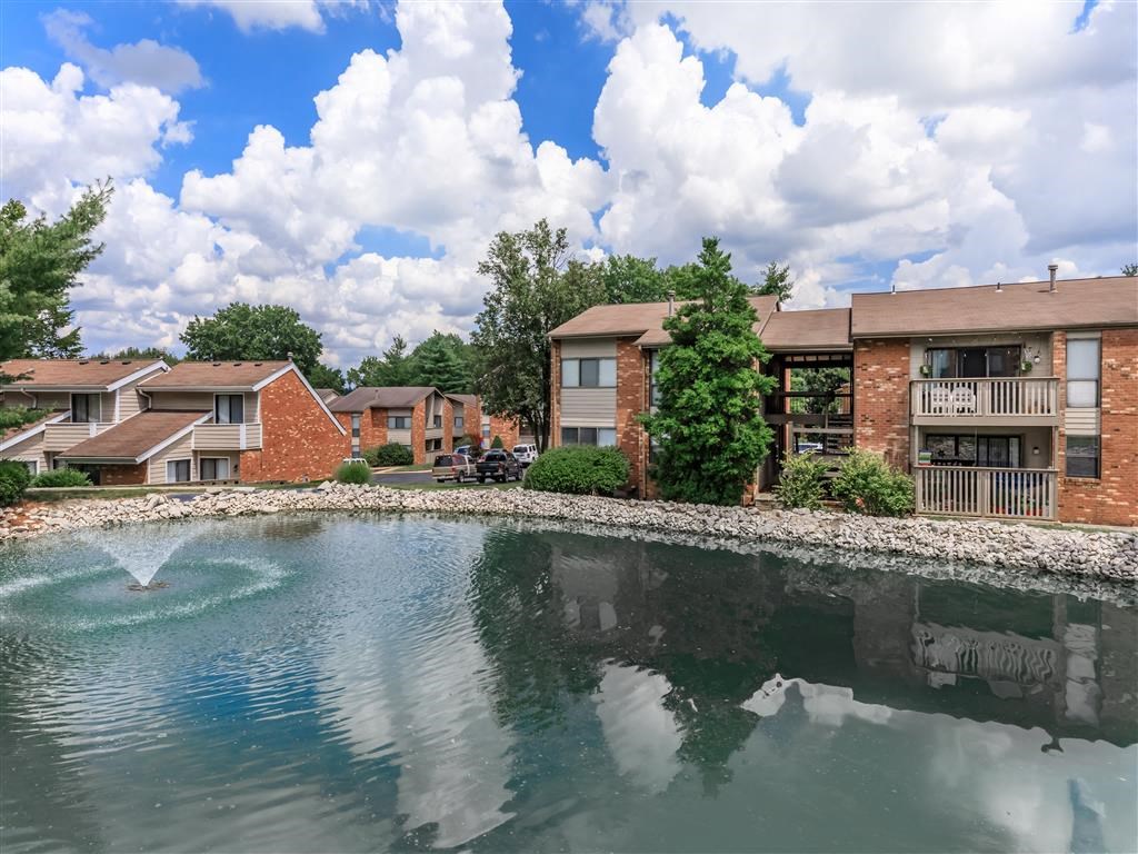 our apartments are located next to a lake with a fountain