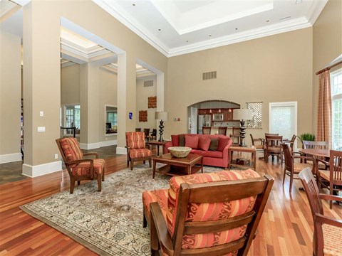 a large living room with furniture and a dining room