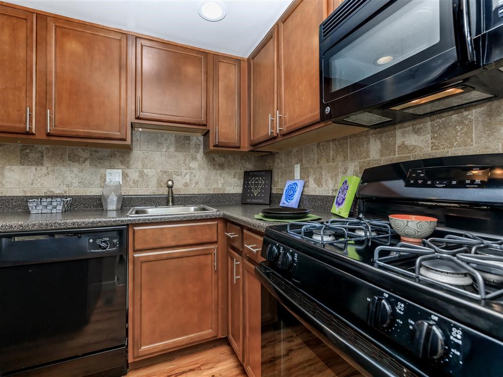 a kitchen with a stove and a microwave
