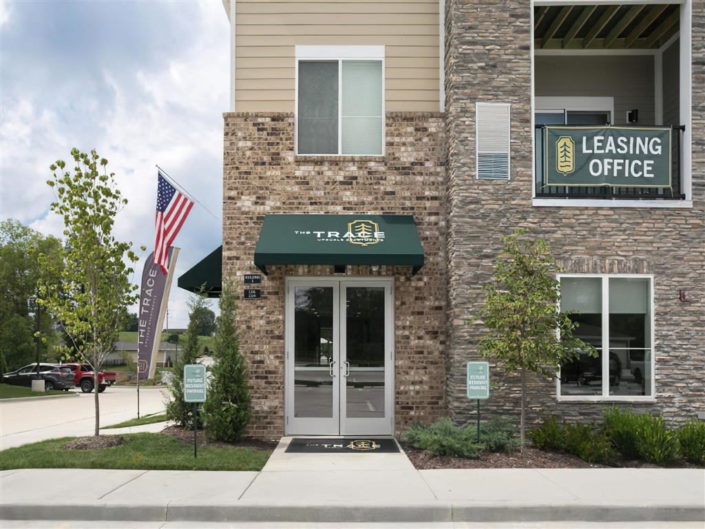 the leasing office at the leading office building has a green awning