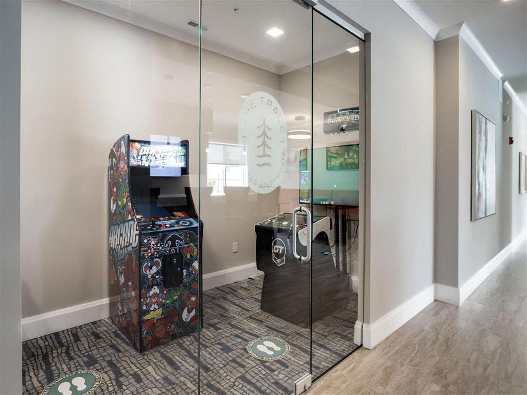 a room with two vending machines and a glass door