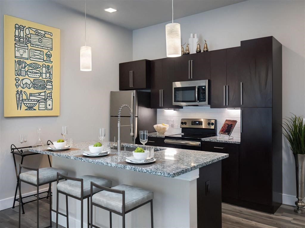 a kitchen with a marble counter top