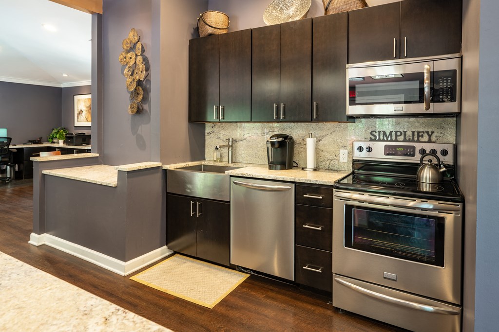 a kitchen with stainless steel appliances and stainless steel cabinets