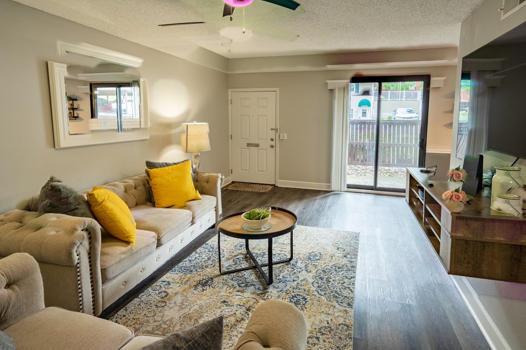 a living room with couches and a coffee table